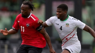Trinidad and Tobago&#039;s Levi Garcia (left) in action against St Kitts and Nevis.