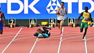 Gardiner falling during his 400m semi-final heat on Tuesday.