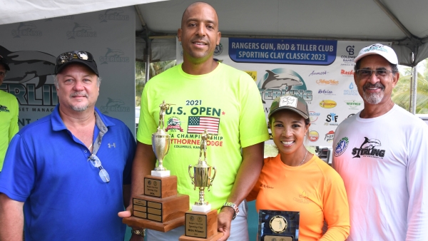 Overall winner - Craig Simpson (2ndL) and Lady&#039;s winner - Wendy McMaster (2ndR) share the happy moment with Gordon Clarke(L), president of Rangers Gun Club and Charles Ross (R) of lead sponsor Sterling Asset Management.