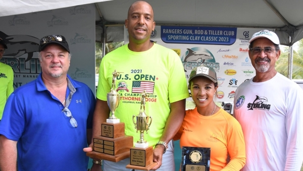 Craig Simpson (second left) and Wendy McMaster with Gordon Clarke (left), President of Rangers Gun Club and Charles Ross (r) of lead sponsor Sterling Asset Management.