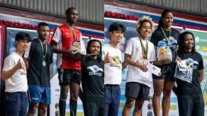 Craig Allison (third from left) and Katherine Wynter (seventh from left) with their prizes after winning the men&#039;s and women&#039;s open singles titles at week two of the JBA Shuttle Showdown Tournament. Beside Allison and Wynter are runners-up Joel Angus and Alexandra Beckford and Jamaica Badminton Academy co-founders Matthew Lee and Kenneth Anglin.