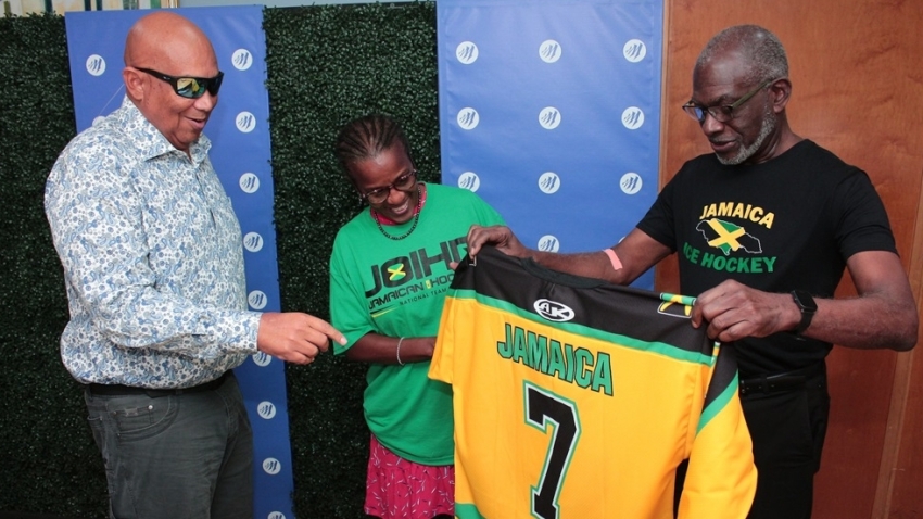 Chris Berry, Executive Chairman of Mayberry Investments Limited (MIL) (left), Dr. Denise Forrest, Director of the Jamaican Olympic Ice Hockey Federation (centre), and Don Anderson, President of the Jamaican Olympic Ice Hockey Federation proudly display the Ice Hockey Jamaican team jersey during a recent handover ceremony hosted by Mayberry Investments Limited.