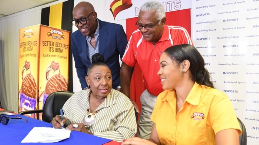 (Standing) JAAA First Vice President the Hon. Ian Forbes, Acting Executive Director on INSPORTS Major Desmond Brown, (seated) Minister of Gender, Culture, Entertainment and Sport, the Hon. Olivia Babsy Grange and Devon Biscuits Brand Manager Sherene Bryan.