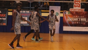 Caribbean Basketball Academy players celebrate after booking their spot in the semi-finals of the Jamaica Basketball Showcase on Friday.