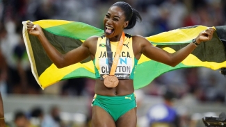 A delighted Rushell Clayton celebrate her bronze medal win in the women&#039;s 400m hurdles in Budapest, Hungary on Thursday.