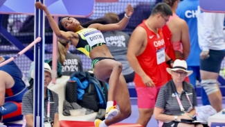 Lamar Distin in flight during the women&#039;s high jump qualification.