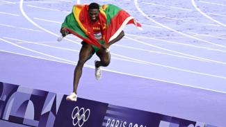 A jubilant Lindon Victor celebrates his bronze medal win.