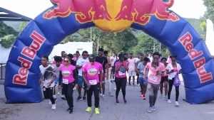 They&#039;re off! The UWI Guild Pink Run kicks off with Lifespan reps Nayana Williams and Olaf Blackwood at forefront.