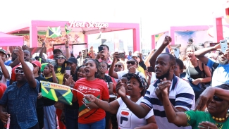 The race was hot! Team Jamaica supporters watched in anticipation as they cheered on Jamaica’s athletes on the track as they sprinted to the finish line. 