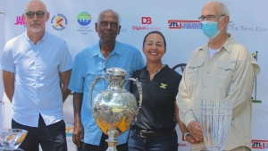 (L-R) Dr. Mark Newnhan - player and vice president of JGA, Gordon Hutchinson  - former JGA president, Jodi Munn-Barrow - JGA president and honouree David Mais share a happy moment at the launch of 56th Jamaica Open Golf Championship earlier this week. the championship will play at Tryall Golf October 29-31.