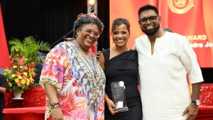 Jordan with Barbados Prime Minister, the Honourable Mia Mottley and Dr Irfaan Ali, President of Guyana after receiving her award on Friday night.