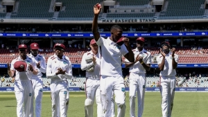 Shamar Joseph leading the West Indies off the field after completing a five-wicket haul in his debut Test match. However, the West Indies are facing defeat against hosts Australia.