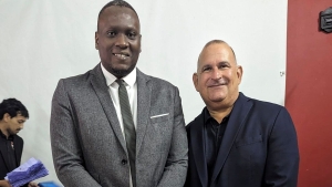 Newly-elected TTFA president Kieron Edwards (left) and Robert Hadad, chairman of the outgoing Normalisation Committee.