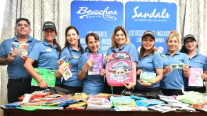 Alenes Garcia (fourth right), Director of Sales and Marketing for Latin America share a photo opportunity with her Business Development Managers, as they display items for the Sandals Foundation outreach programme.