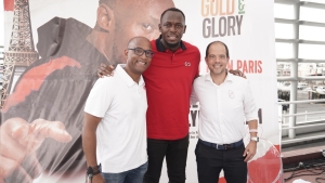 Jamaica&#039;s sprint legend Usain Bolt (centre) shares a photo opportunity with Red Stripe’s Head of Commerce, Sean Wallace (left) and Managing Director, Daaf van Tilburg during the event&#039;s launch.