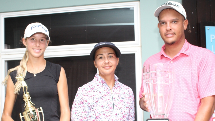 Two first time National Amateur Golf Champions - Mattea Issa (L) and Zandre Roye (R) share the happy moment with Jodi Munn-Barrow, president of the Jamaica Golf Association. The three-day championship ended on Sunday at the Caymanas Golf Course in St. Catherine.