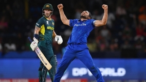 Naib celebrates taking the wicket of Matthew Wade as Afghanistan powered towards victory on Saturday night.