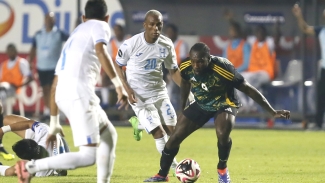 Jamaica&#039;s scorer Michail Antonio tries to get away from defenders.