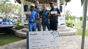 Jonathan Newnham (second let), Director of Operations at Sandals Golf and Country Club and Heidi Clarke (second right), Executive Director of Sandals Foundation, are flanked by overall champions Cavani James (left) and Tajay Lobban.