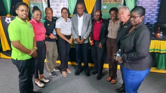 Pengelley (second right) implored Corporate Jamaica to get on board. He stands with JFF President Michael Ricketts (c) sponsor representatives and members of the JFF executive following a press conference at the JFF Headquarters on Wednesday to announce the launch of a new sponsor as well as new and returning sponsors of the national football programme.