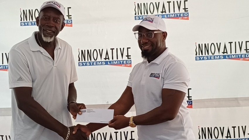 Organizer of the Innovative Invitational Amateur Tennis Classic, Llockett McGregor (left) accepts the sponsorship cheque from Executive Chairman of Innovative Systems Limited, Garth Walker (right).