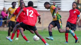 St Benedict&#039;s College Captain Derrel Garcia (second from left) dribbling against St Anthony&#039;s defense during the SSFL Premiership match at the St Anthony&#039;s College Ground on October 07, 2024 in Westmoorings.