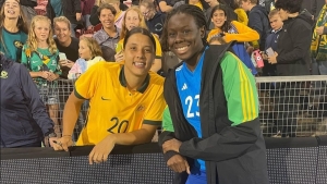 Reggae Girlz goalkeeper Liya Brooks share a photo opportunity with Australian star Sam Kerr during their visit Down Under for the Cup of Nations tournament earlier this year