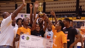 Caribbean Basketball Academy hoists the Jamaica Basketball Showcase trophy.