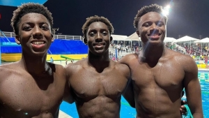 (From left) Caleb Ferguson, Tristin Ferguson and Ayrton Moncur share a photo opportunity after securing a Bahamian sweep of the boys&#039; 15-17 100m freestyle at the Goodwill Swimming Championships in Jamaica.