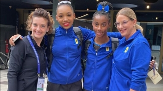 Barbadian gymnasts Olivia Kelly (second left) and Anya Pilgrim (second right) are flanked by their coaches Ashley Umberger (left) and Jenny Rowland in Antwerp, Belgium.