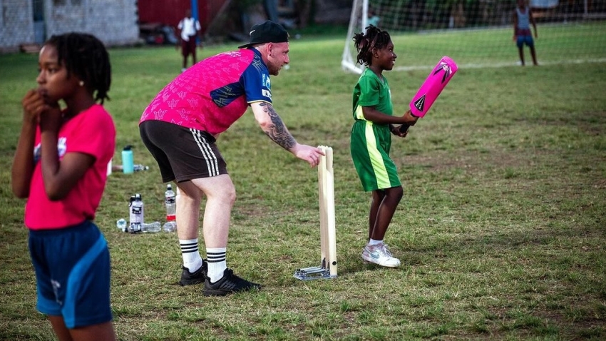 James Pyatt conducts a warm-up session at the launch of the Barbados Royals Girls Cricket Club at the Passage Road Pavilion on Thursday.