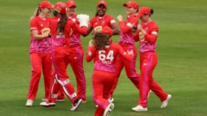 Hayley Matthews and Welsh Fire teammates celebrate a wicket.