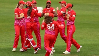 Hayley Matthews and Welsh Fire teammates celebrate a wicket.