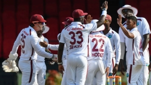 West Indies celebrate a wicket.