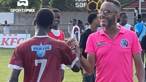 St George&#039;s College&#039;s Head coach Neville Bell greets Ronaldo Stewart of St Catherine after the game.