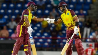 Evin Lewis (left) and Shai Hope share a light moment during their record partnership.