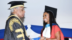 Fraser-Pryce receiving her honorary doctorate from Sir George Alleyne, then Chancellor of the UWI in 2016.