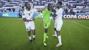 St. Kitts &amp; Nevis trio (from left) Romaine Sawyers, Julani Archibald and Rowan Liburd celebrating after their 3-2 penalty shootout win over Curacao.