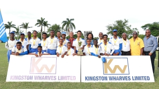 Winning team Westmoreland celebrate winning this year’s Kingston Wharves U15 Cricket Competition at Ultimate Cricket Ground recently in St. Ann. Sharing the happy moment with the team were Dr. Donovan Bennett – JCA president (in purple), Simone Murdock – corporate services and client experience manager at Kingston Wharves (in blue), Deltonia Williams – Westmoreland CA president (in yellow) and Courtney Francis – JCA CEO (right). Team captain Ryan Littleton holds trophy and coach Grantley Reid (beside Simone Murdock) celebrate with the full team.