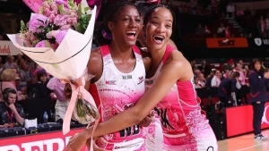 Jamaicans Latanya Wilson (left) and Shamera Sterling-Humphrey share a light moment after the game.